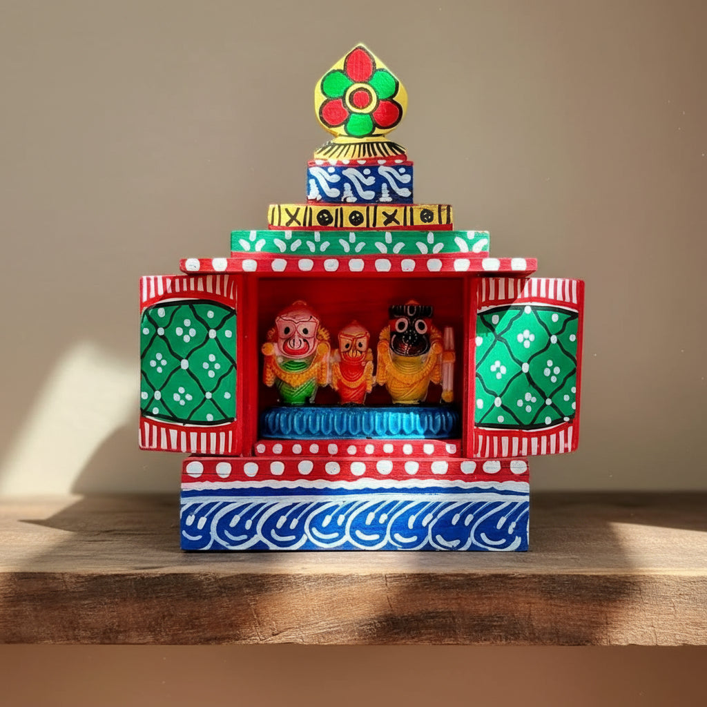 Colorful decorative box with figurines on a wooden surface