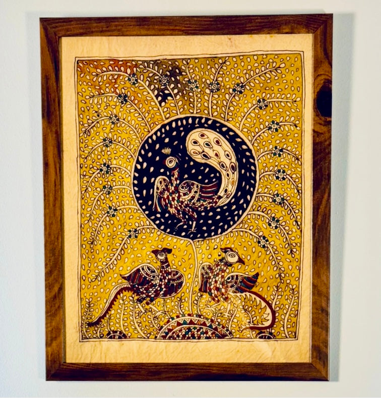 Decorative wall art with birds and a moon design on a yellow background, framed in wood.