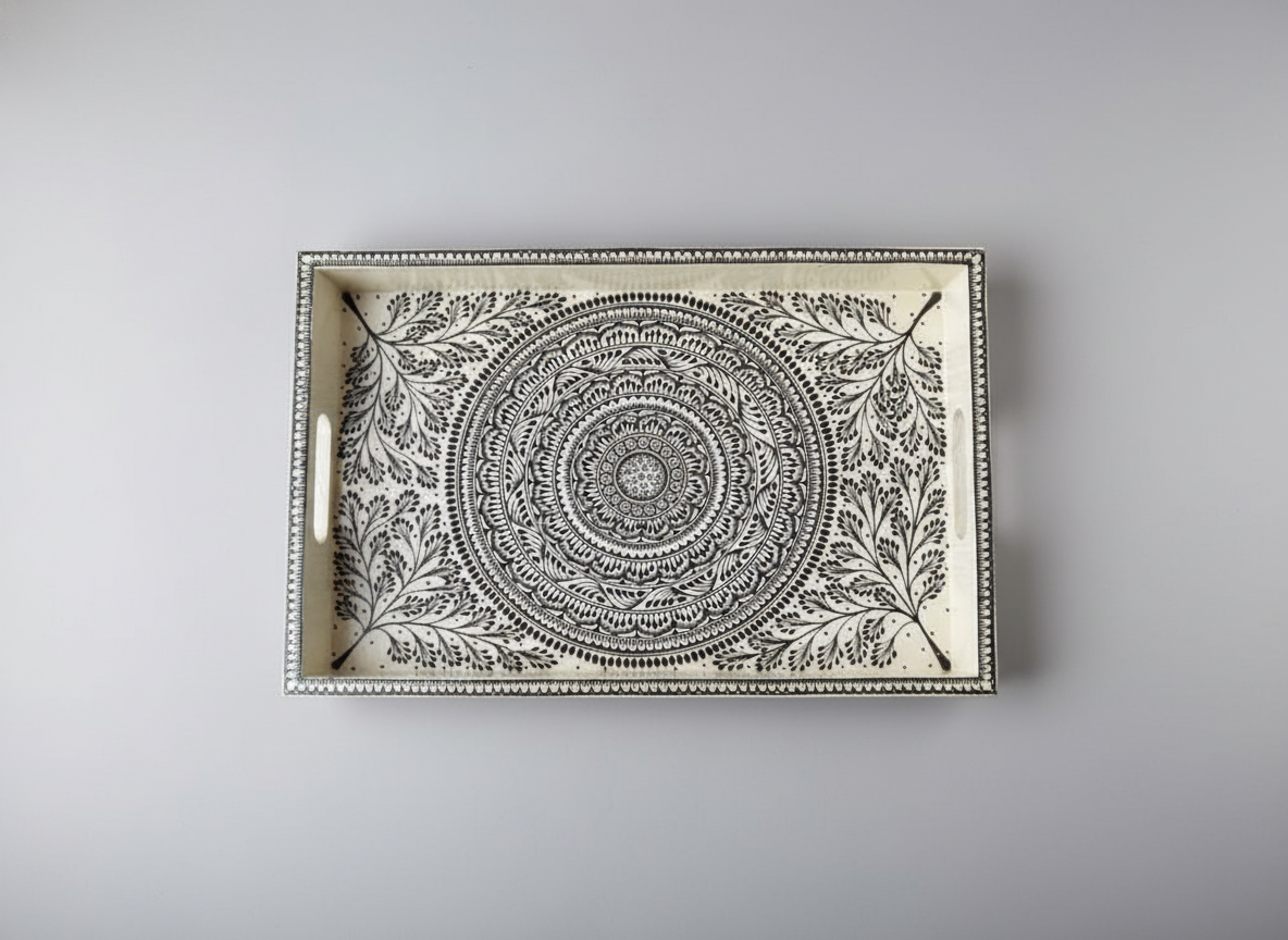 Decorative tray with mandala design on a gray background