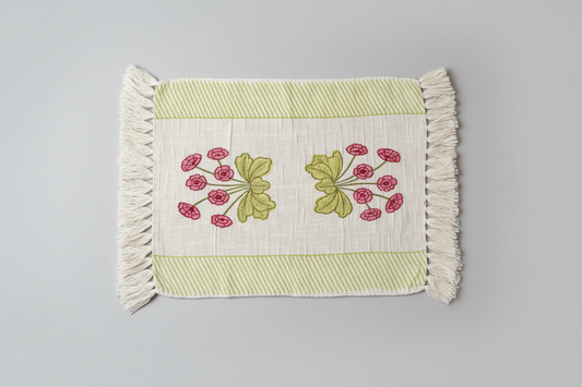 Hand block printed placemat with floral design on a gray background