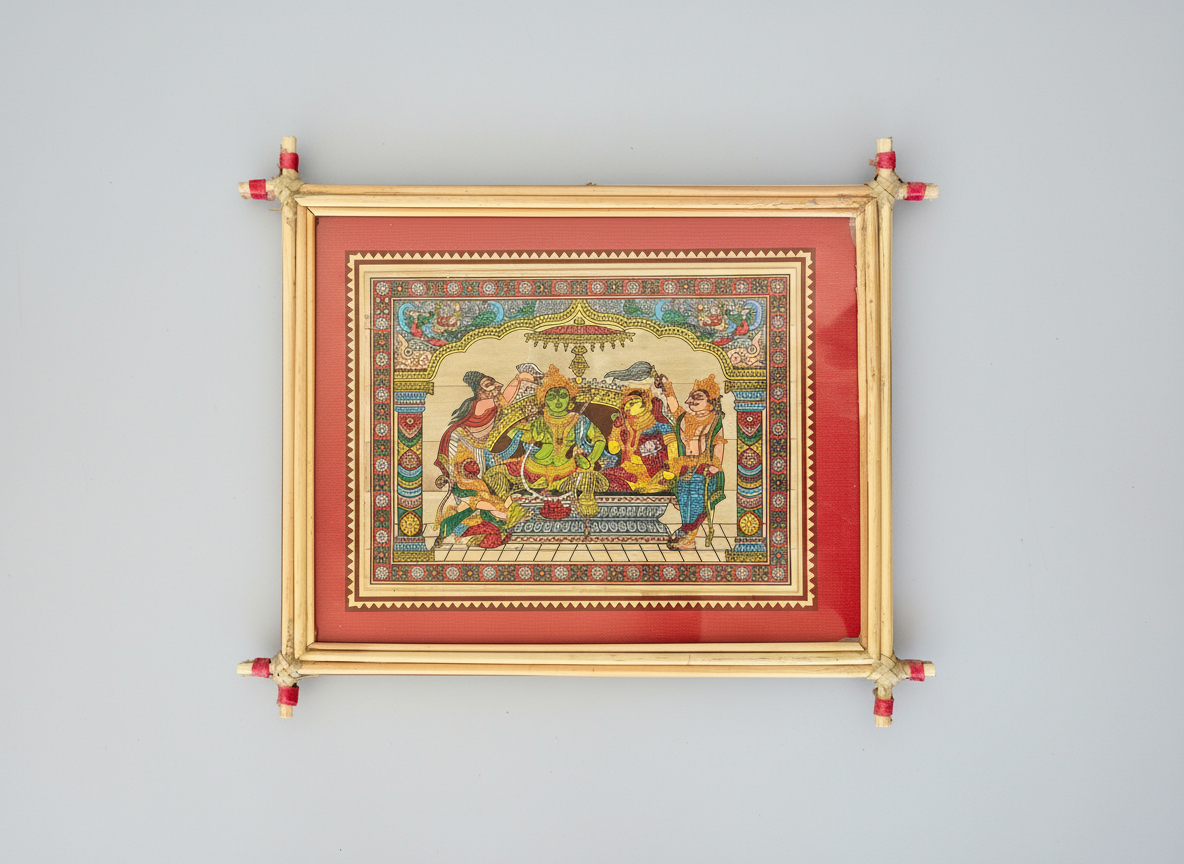 Decorative framed artwork with a colorful design on a blue background