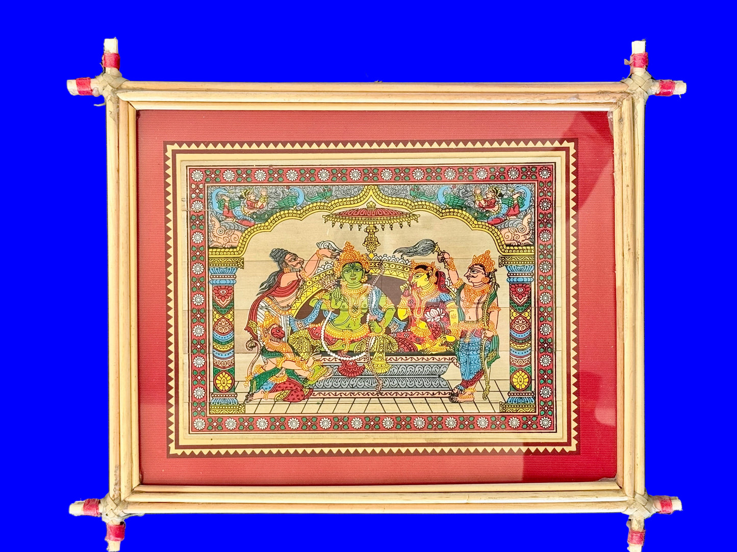 Decorative framed artwork with a colorful design on a blue background