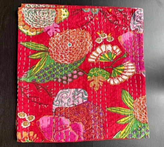 Colorful floral-patterned fabric on a dark surface