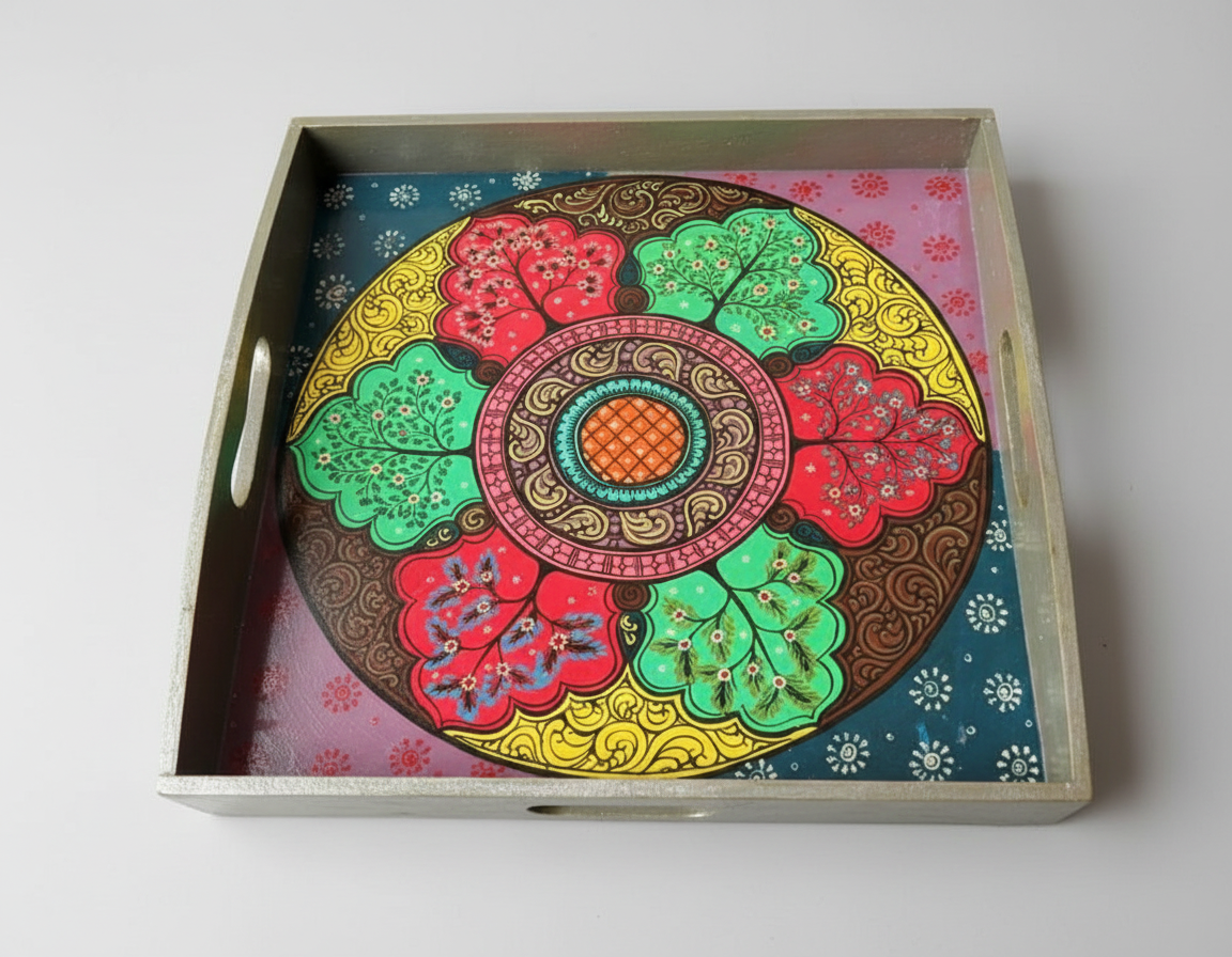 Decorative tray with a colorful circular design on a white background