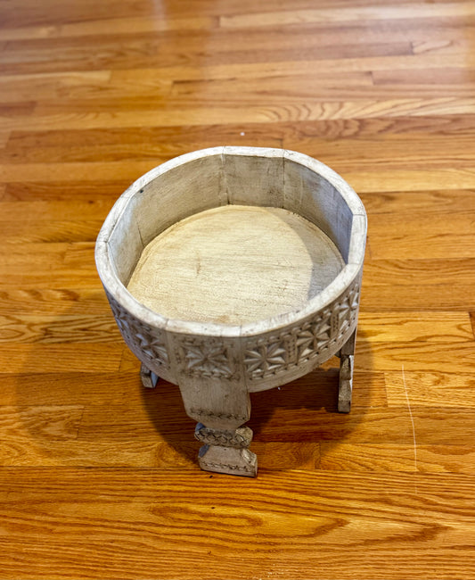 Decorative vintage wood bowl on a wooden floor