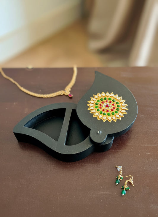 Exquisite Tanjore work wooden boxes in various shapes, featuring intricate gold detailing and traditional Indian artistry.