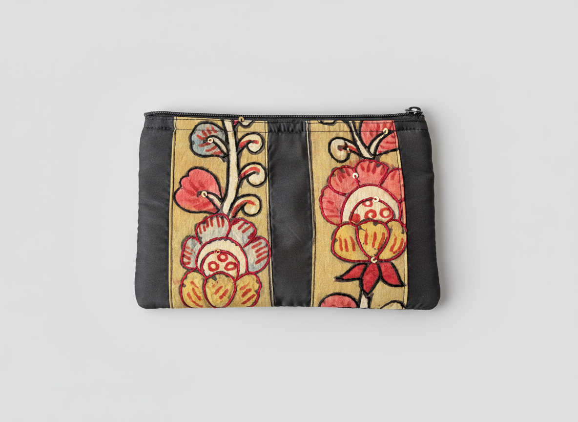 Floral patterned pouch with black border on a light gray background