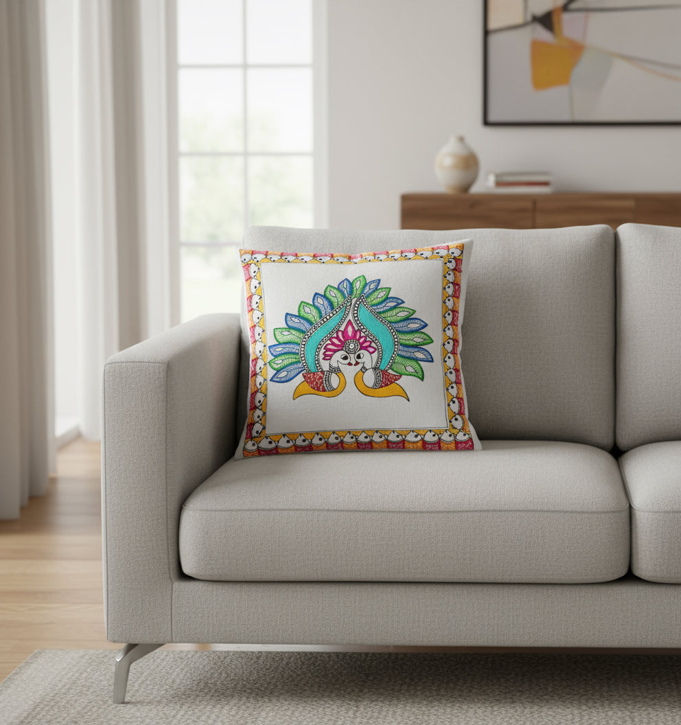 Colorful Madhubani artwork of a peacock with a decorative border on a white cushion cover