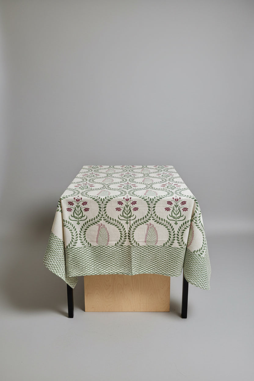 Living room with a table covered by a hand block print patterned tablecloth