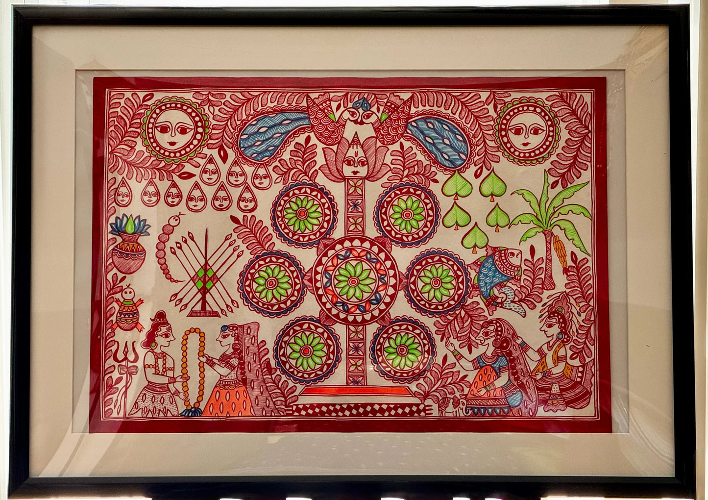 Framed Madhubani Kohbar artwork with intricate designs and patterns