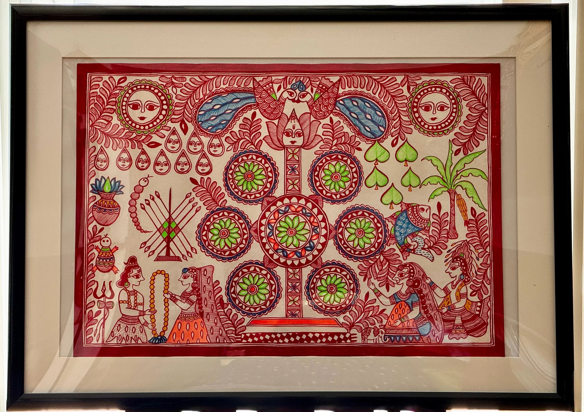 Framed Madhubani Kohbar artwork with intricate designs and patterns