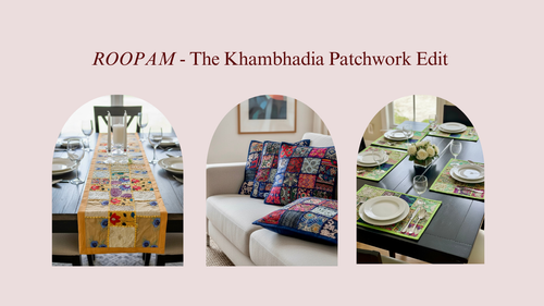 Table setting with patchwork tablecloth and pillows, featuring ROOPAM brand.