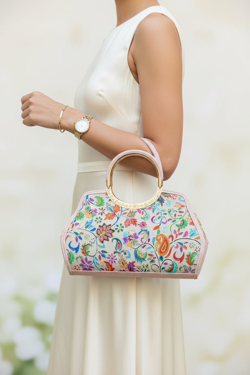 Colorful Kashmiri embroidery handbag with floral patterns on a wooden surface