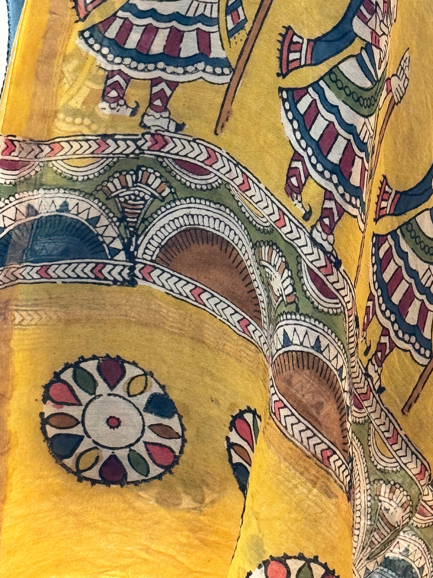Decorative stole with intricate Mata ni Pachhedi art hand painted on a yellow background