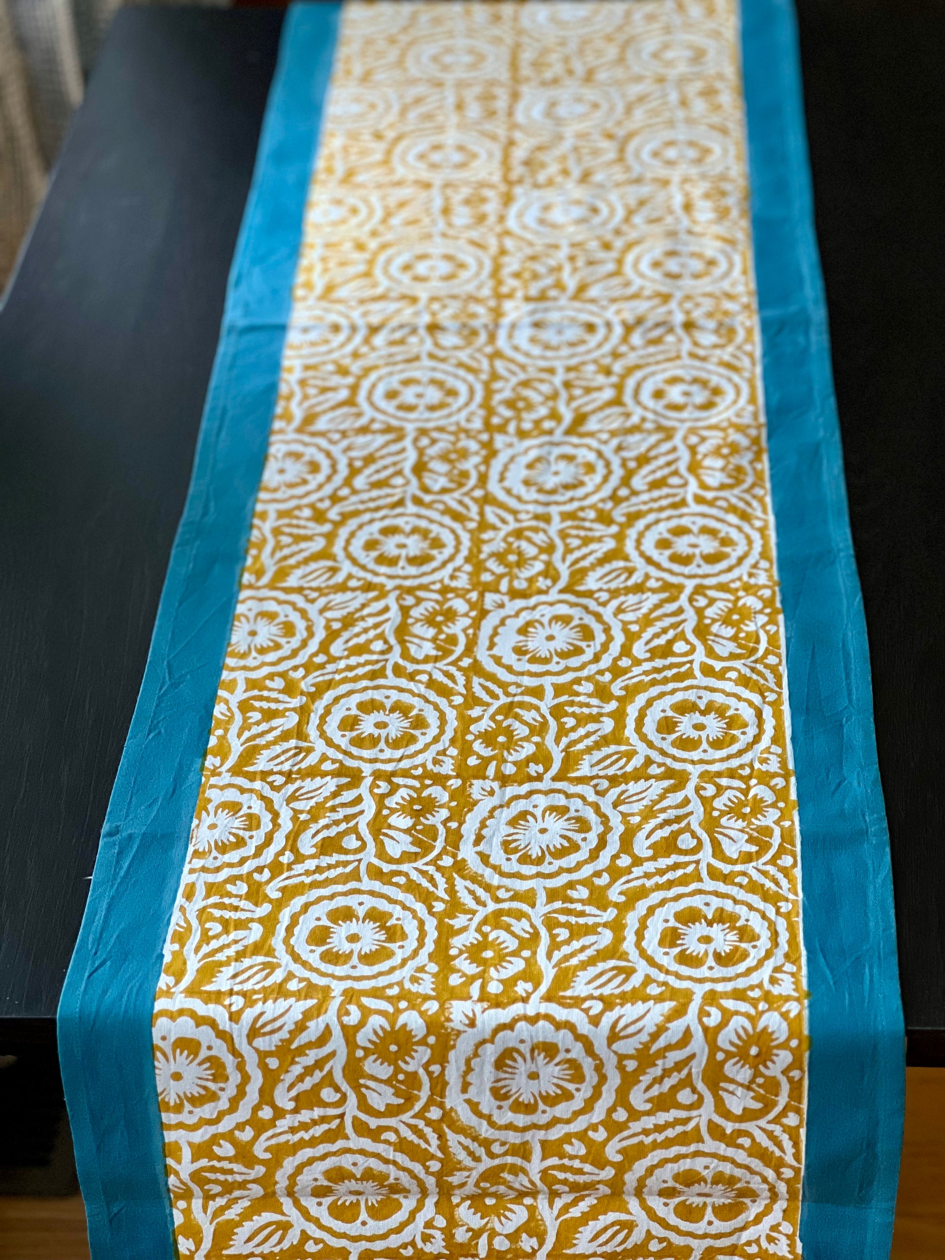 Pure cotton hand block printed table runner, featuring intricate patterns and vibrant colors, adding a touch of traditional craftsmanship to your dining decor.